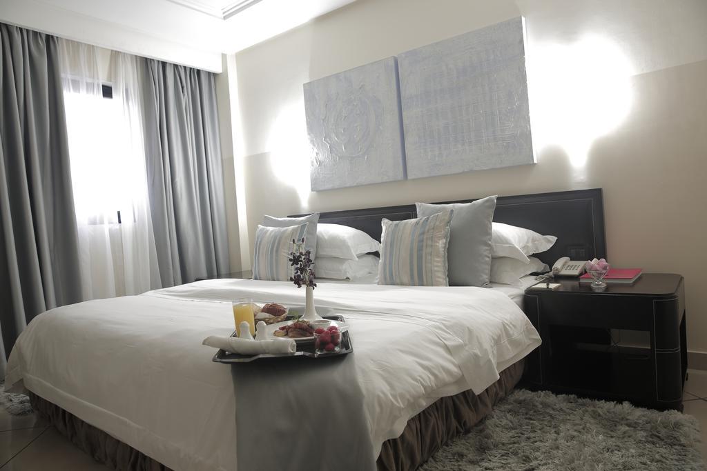Oak Plaza Hotels East Airport Άκρα Δωμάτιο φωτογραφία